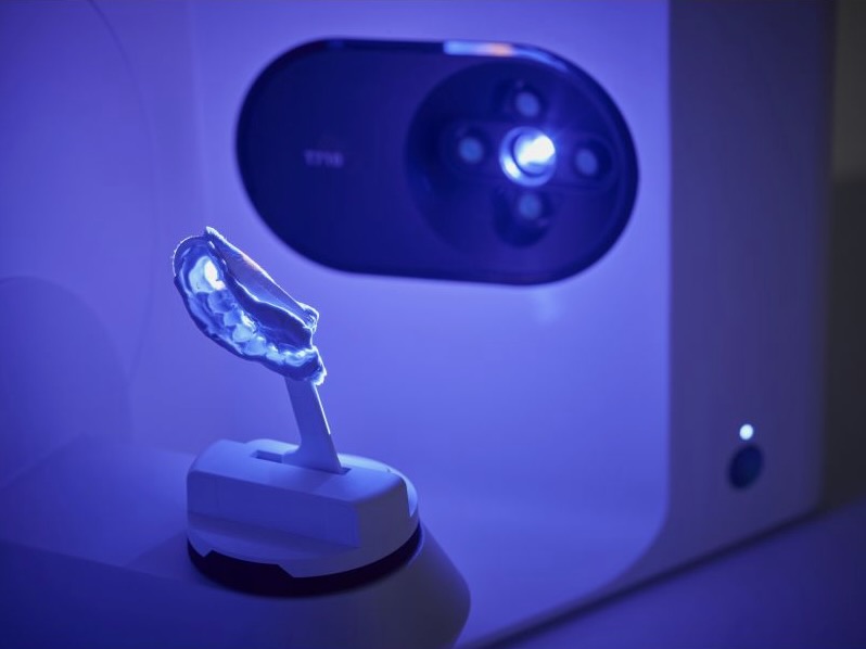 Clinician capturing a digital impression of a patient's teeth with an intraoral scanner