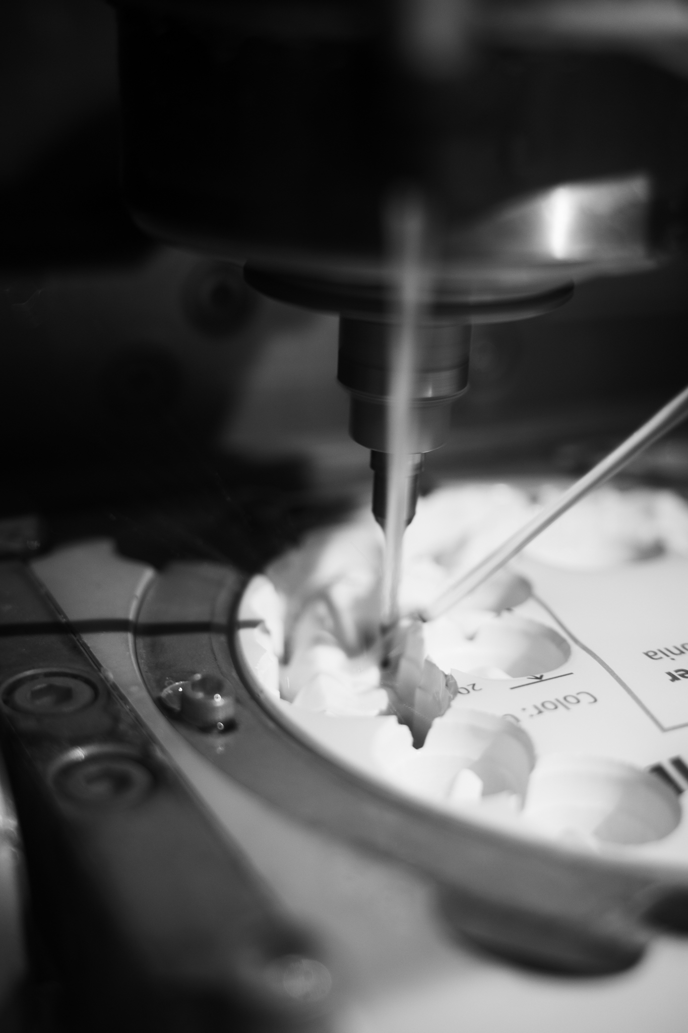 Milling spindle cutting a zirconia restoration in the Integra Dental milling center