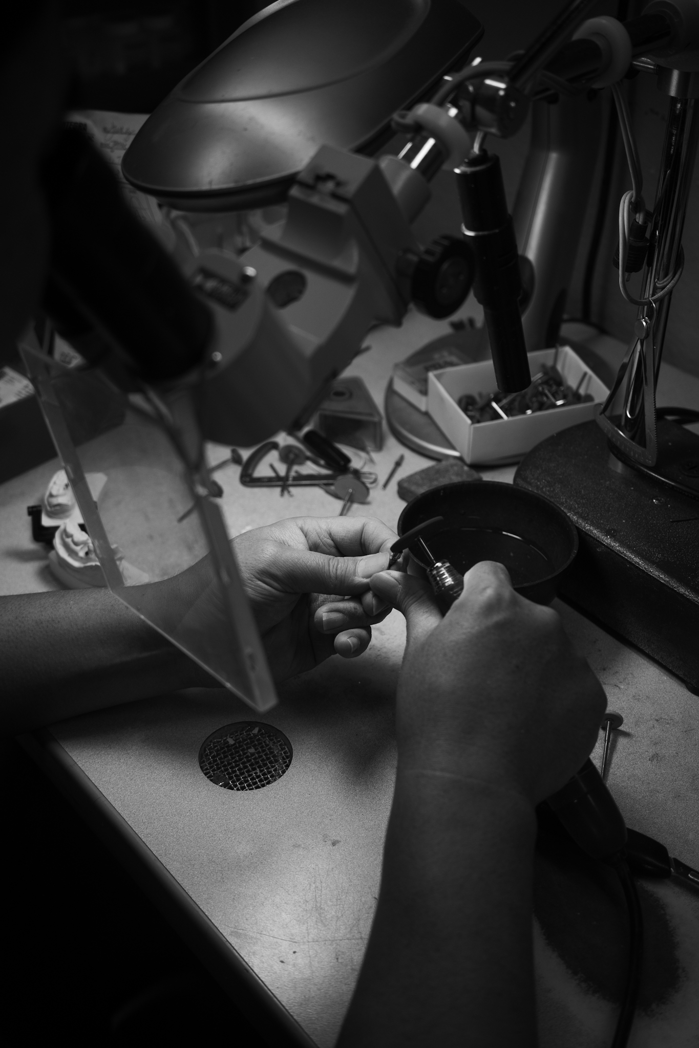 Technician at microscope