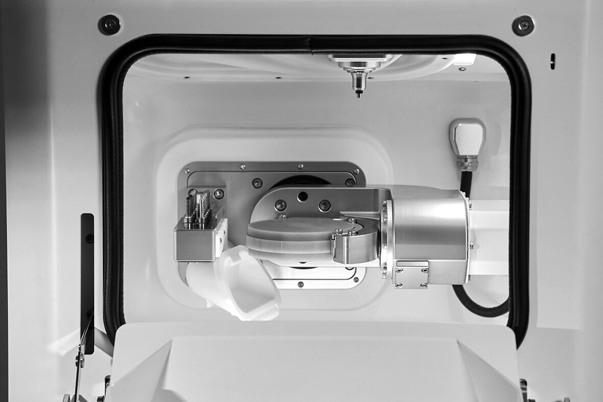 Inside the ARUM A3 Pro milling chamber, spindle and tooling visible