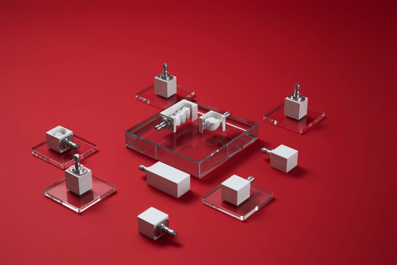 Implant components and ti-bases arranged on a red surface