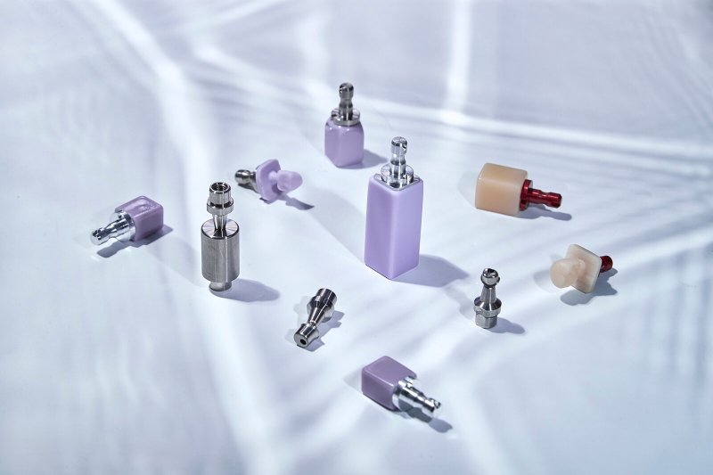Ti-bases and implant components resting on silk