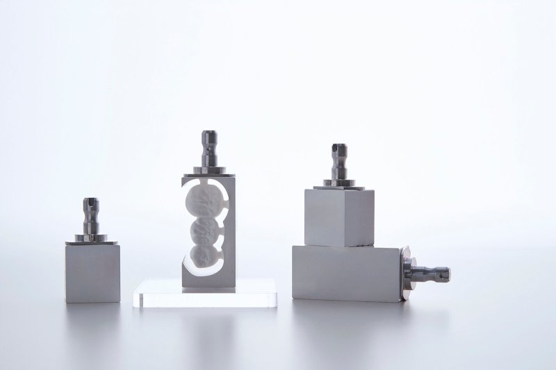 Titanium premill blanks on a display pedestal