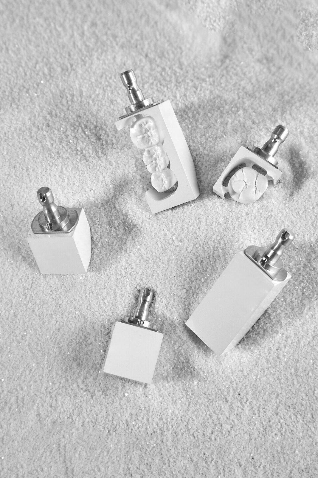 Ti-base and screw components standing in a studio still life