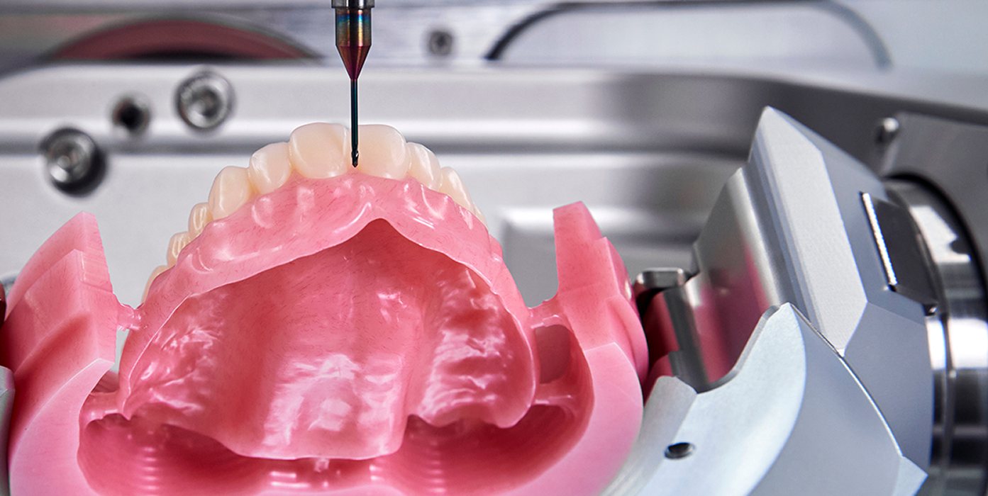 Digital denture being milled with ApexMill toolpaths on an ARUM mill
